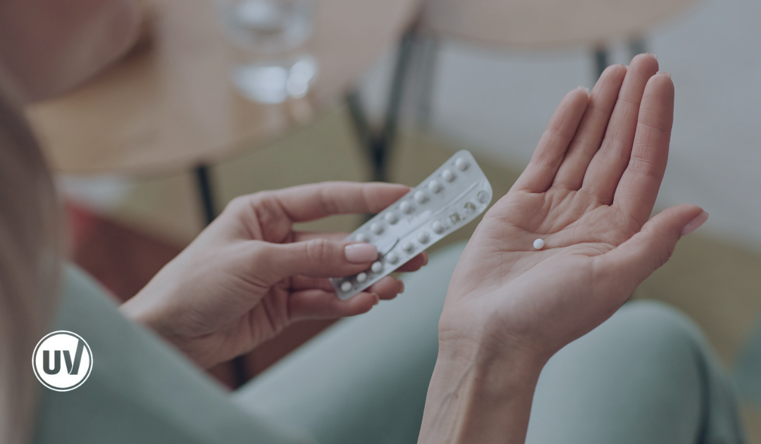 Image of woman holding birth control