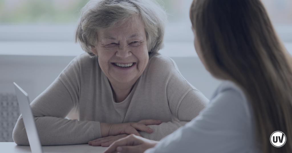 Older woman discussing fibroids after menopause with her vascular specialist 